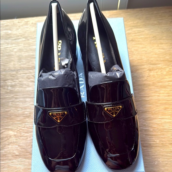 Prada Black Patent Leather Loafers with Metal Emblem - Picture 1 of 8